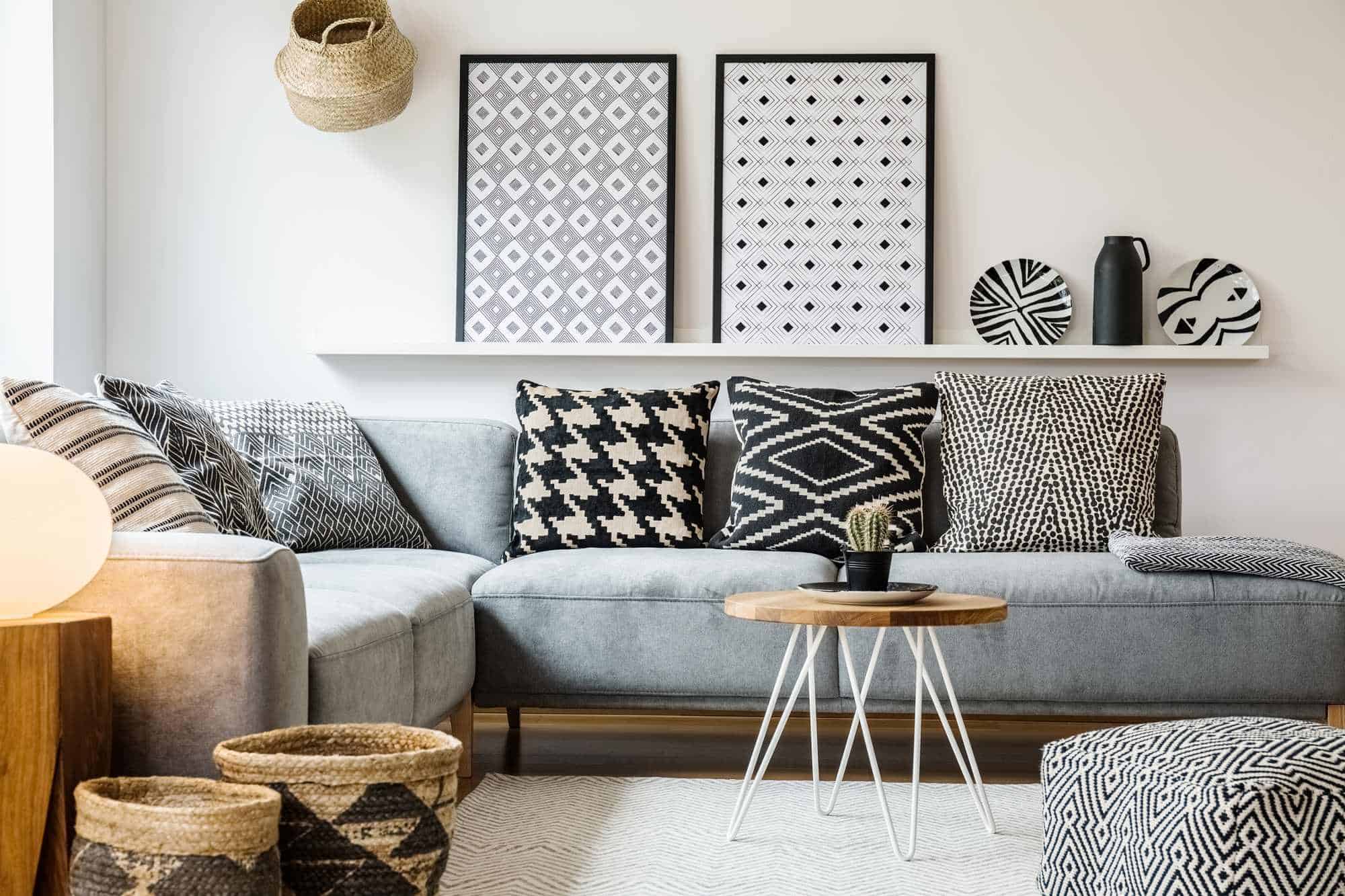 photodune-22350383-patterned-pillows-on-grey-corner-sofa-in-apartment-interior-with-xxl-1